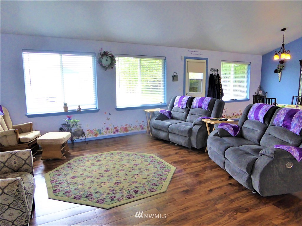 8637 194th Avenue Southwest Rochester, WA 98579 - Photo 10 of 37 a living room with furniture and a large window