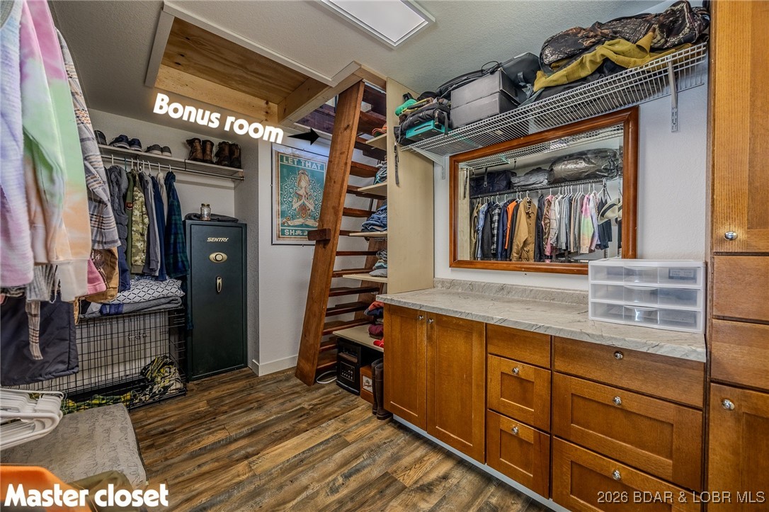 81 Restless Point Camdenton, MO 65020 - Photo 36 of 75 Primary suite walk-in closet with access to bonus