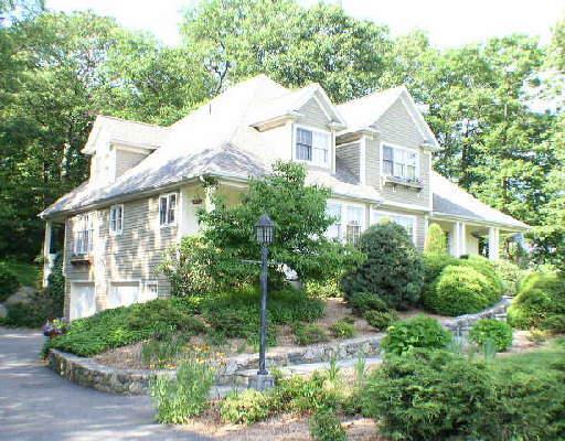 9 Marlin Road Newtown, CT 06482 - Photo 1 of 1 a front view of a house with a yard and potted plants