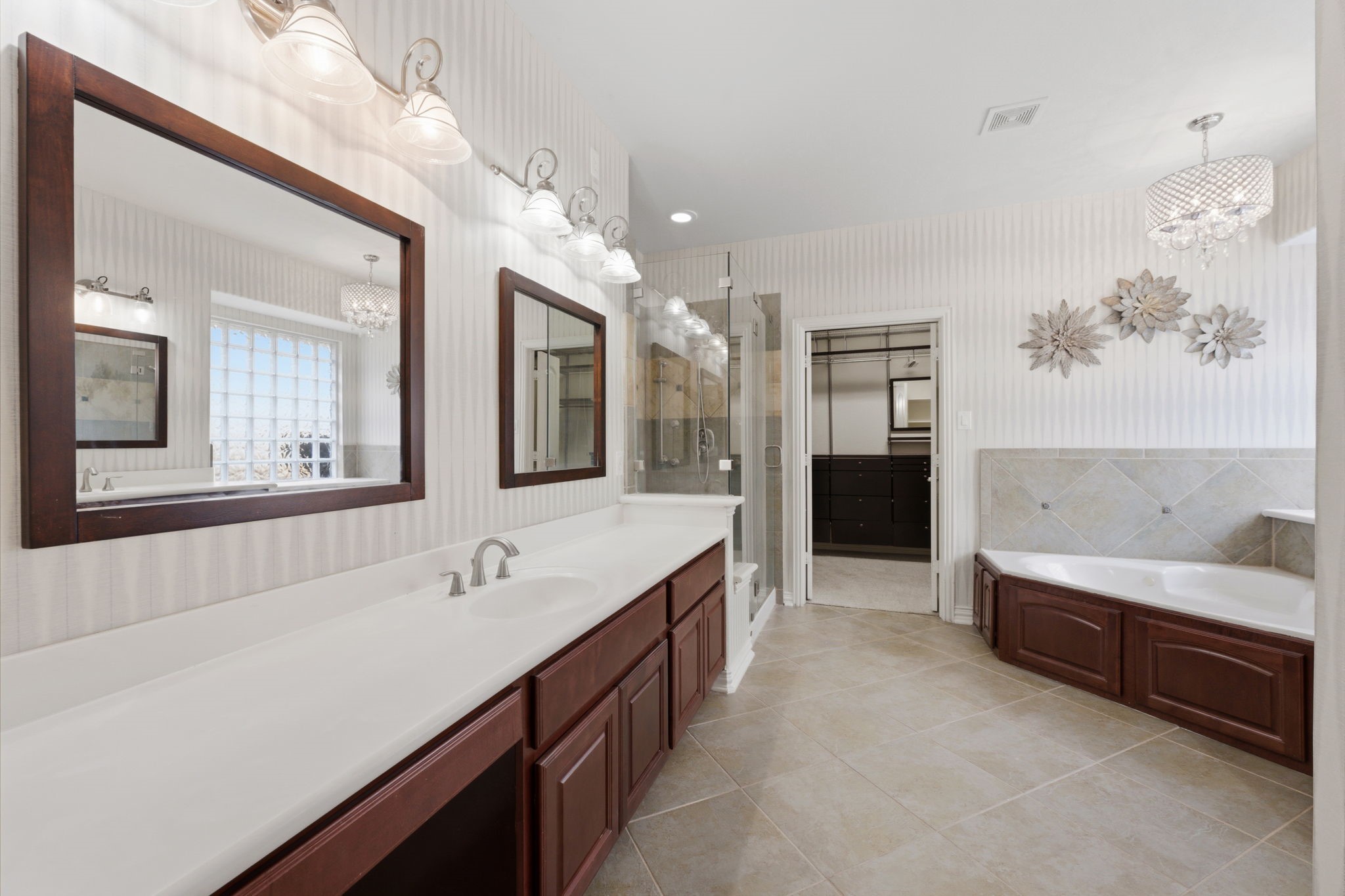 315 Arbor Ridge Lane Conroe, TX 77384 - Photo 21 of 48 a spacious bathroom with a tub double sink and mirror
