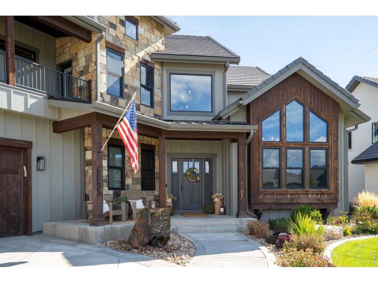 2734 Southwind Road Berthoud, CO 80513 - Photo 3 of 50 Front patio with stone water feature
