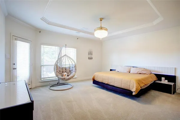 a bedroom with a bed and a television