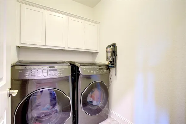 a bathroom with a shower and a sink