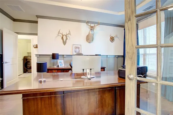 a bathroom with a sink and a large mirror