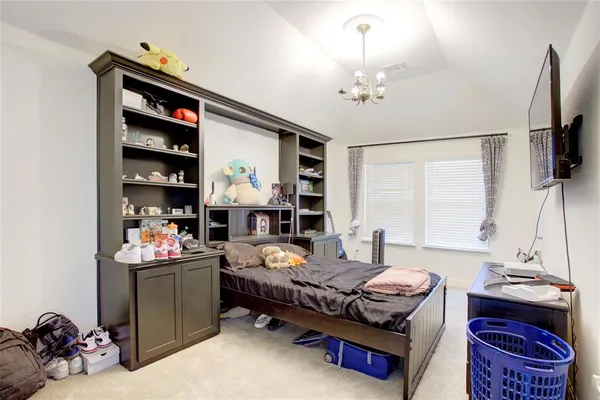 a room with pool table and windows