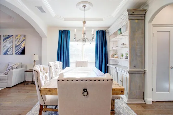 a dining room with furniture and window