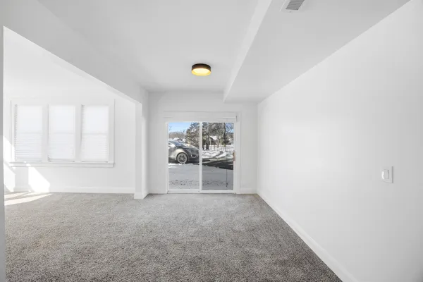 a view of an empty room with a window