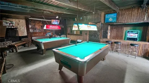 a room with pool table table tennis pool table and a window
