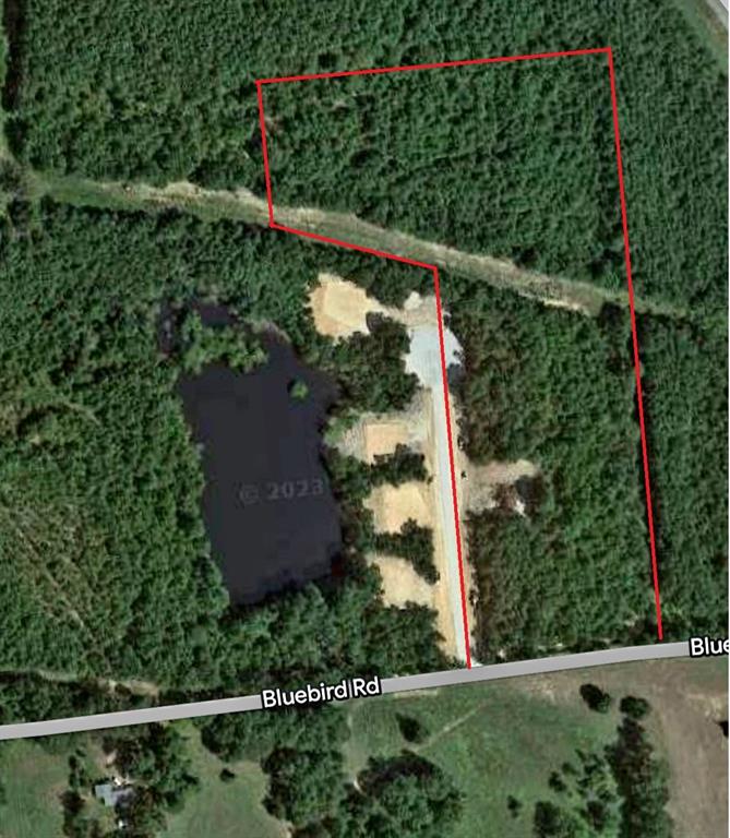 an aerial view of a yard and street