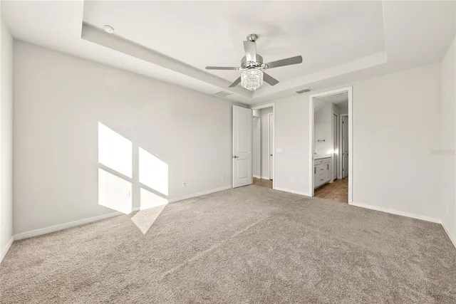 a view of empty room with a ceiling fan