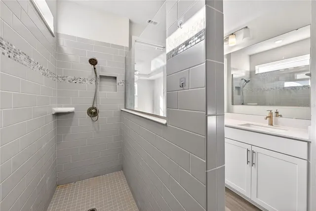 a view of a livingroom with wooden floor and a window