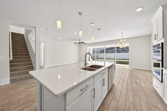 a kitchen with a sink and stove