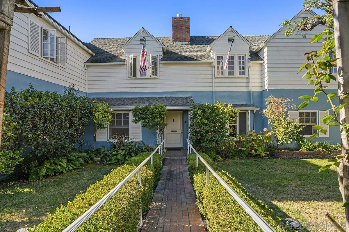a view of house with yard and green space