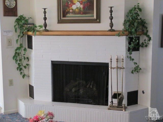 1225-5 South Rice Road, Unit 5 Ojai, CA 93023 - Photo 38 of 41 a close view of a fireplace in a living room