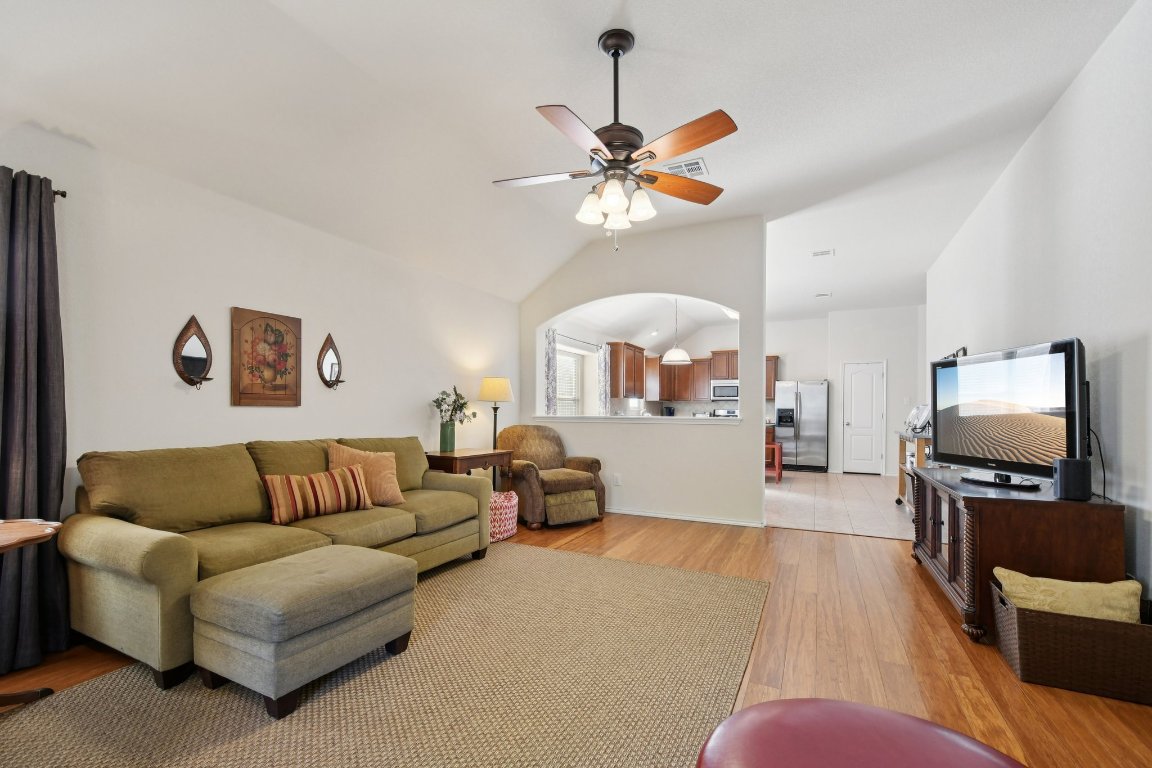 1028 Hot Spring Valley Buda, TX 78610 - Photo 16 of 39 a living room with furniture and a flat screen tv