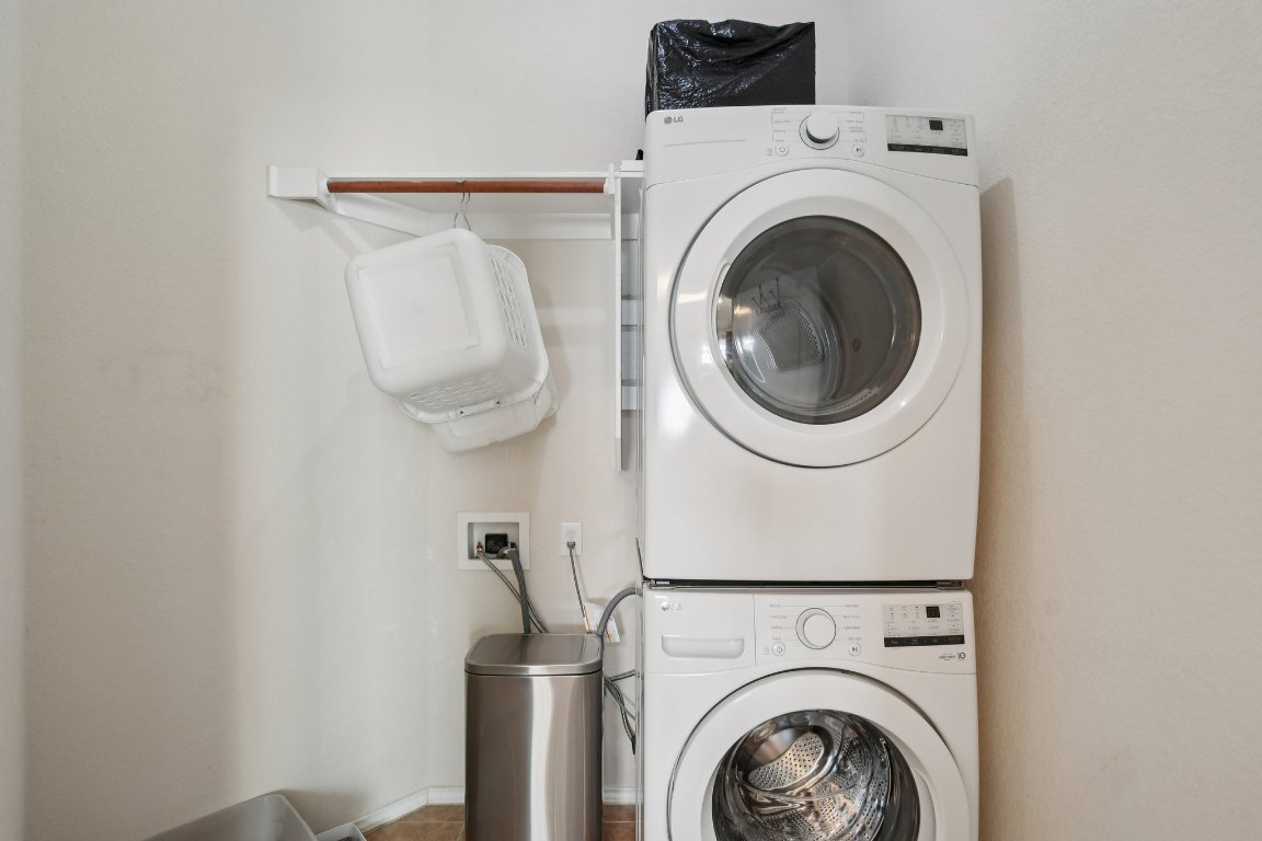 1028 Hot Spring Valley Buda, TX 78610 - Photo 17 of 39 a utility room with dryer and washer