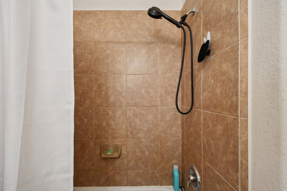 1028 Hot Spring Valley Buda, TX 78610 - Photo 27 of 39 a bathroom with a shower