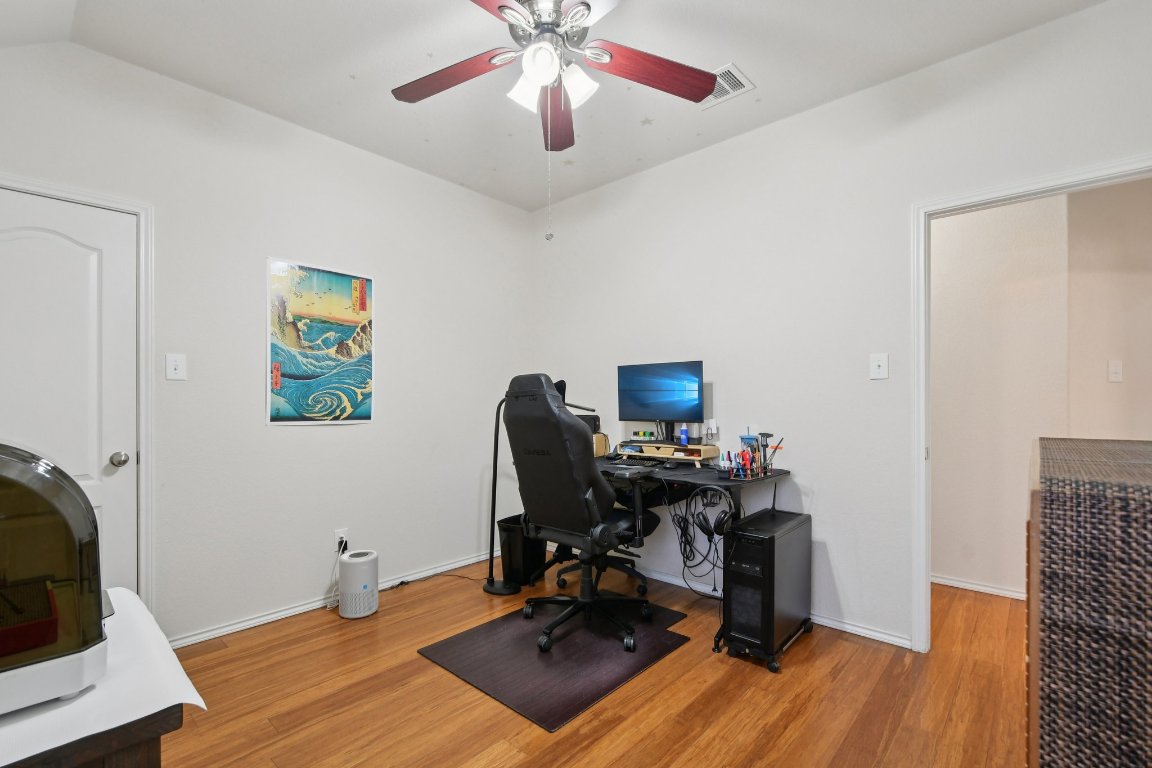 1028 Hot Spring Valley Buda, TX 78610 - Photo 29 of 39 a view of a workspace with furniture and a window