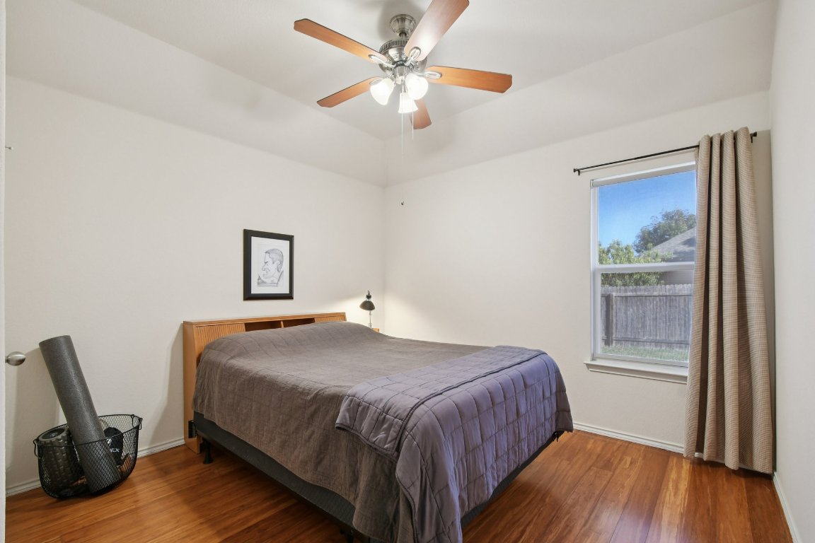 1028 Hot Spring Valley Buda, TX 78610 - Photo 30 of 39 a bedroom with a bed and a window