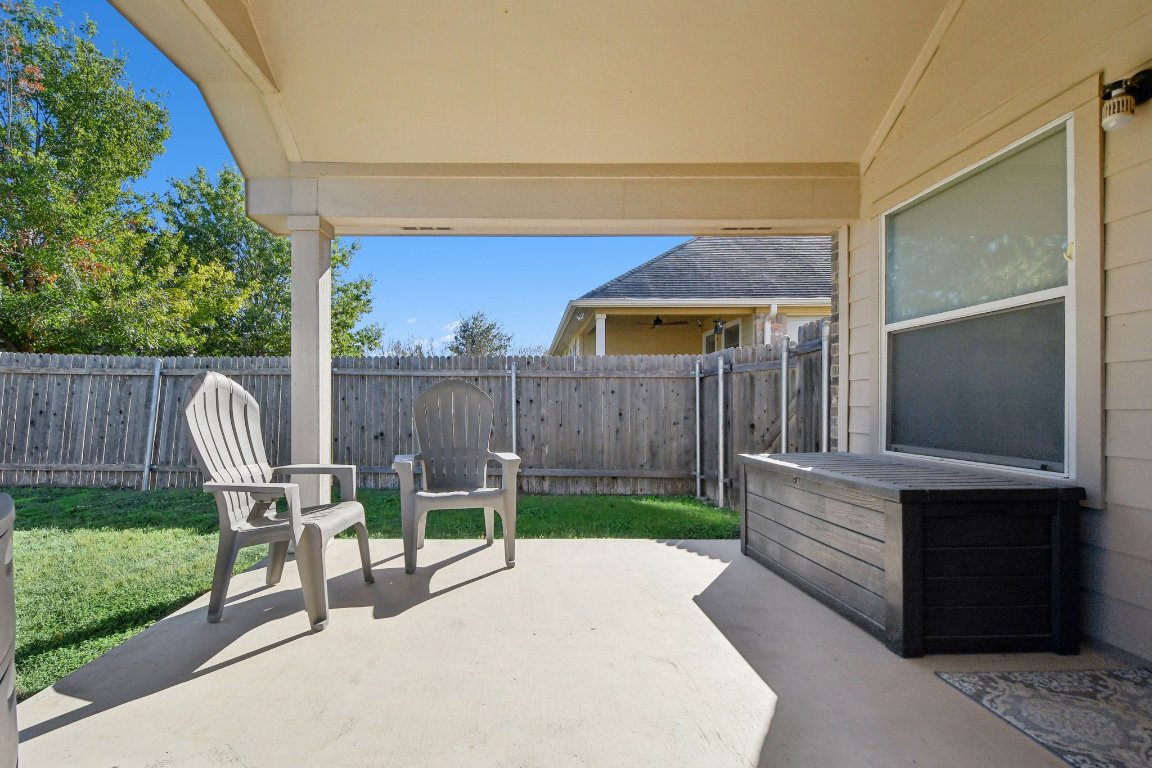 1028 Hot Spring Valley Buda, TX 78610 - Photo 35 of 39 a view of a deck with wooden fence and a bench