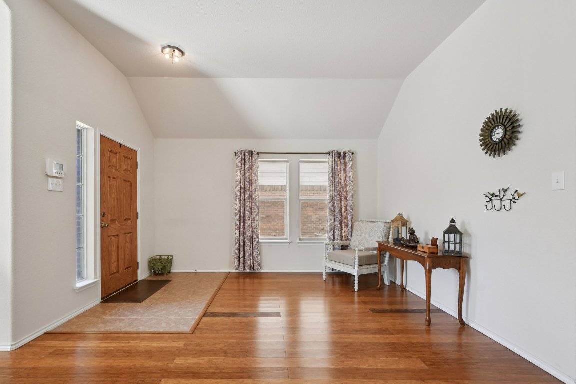 1028 Hot Spring Valley Buda, TX 78610 - Photo 4 of 39 a living room with furniture and a wooden floor