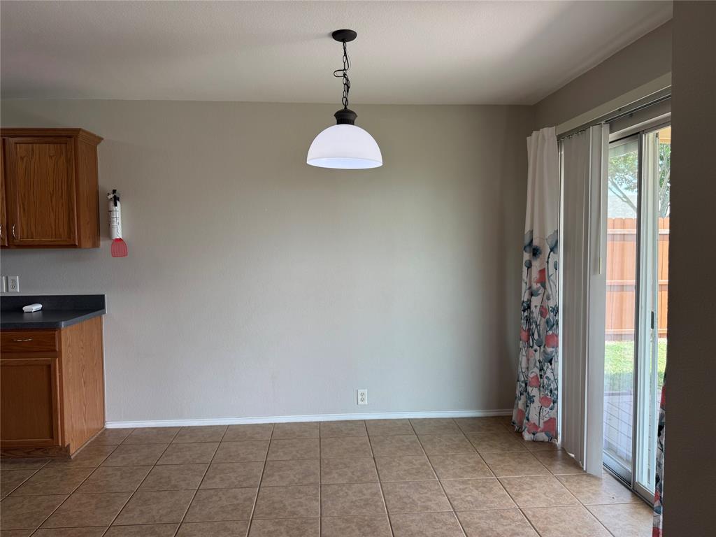 4514 Quail Run Road Sherman, TX 75092 - Photo 21 of 34 Unfurnished dining area with light tile patterned flooring