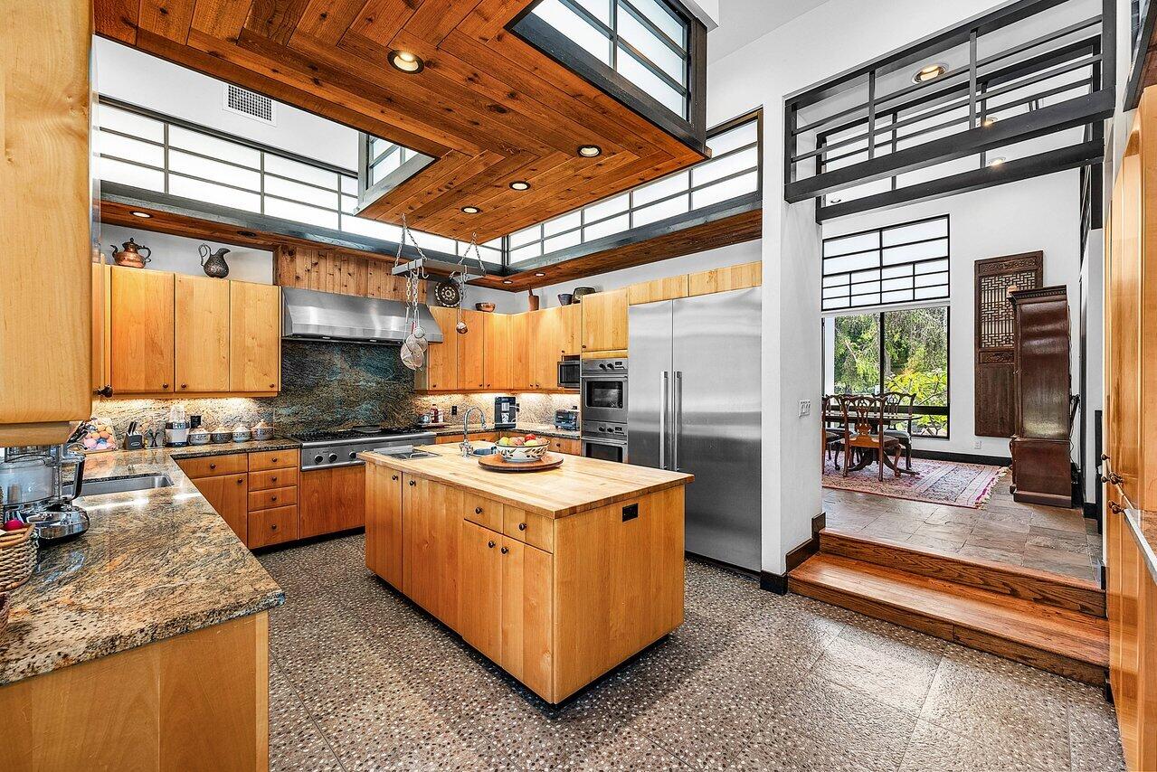 8549 Surrey Lane Boca Raton, FL 33496 - Photo 18 of 106 a kitchen with a stove a sink and a refrigerator
