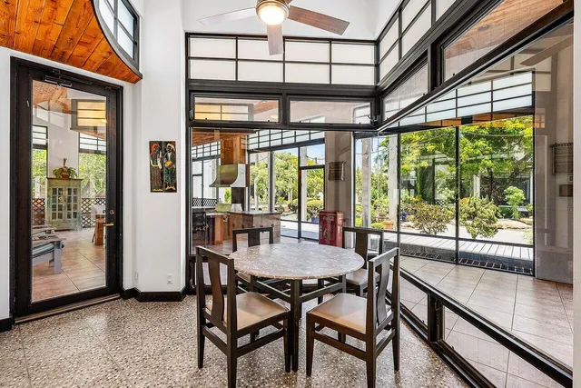 a front view of a house with a garden and porch