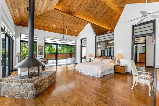 a view of a house with a yard and swimming pool