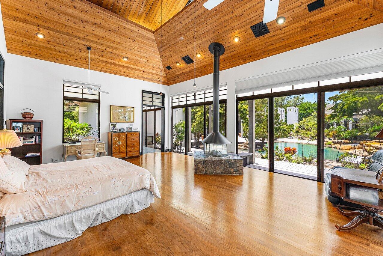 8549 Surrey Lane Boca Raton, FL 33496 - Photo 28 of 106 a large bedroom with a large bed and large windows