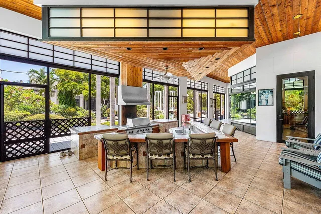 a view of a big yard with a house in the background