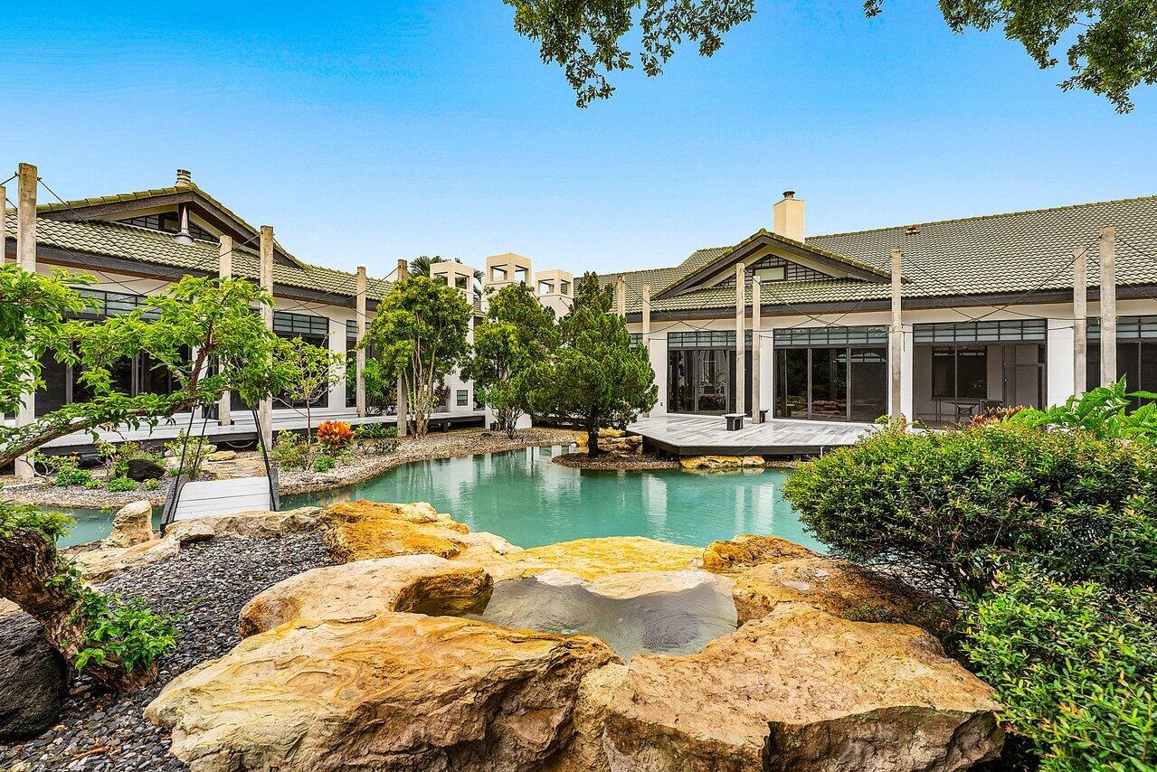 8549 Surrey Lane Boca Raton, FL 33496 - Photo 52 of 106 a view of a house with pool and chairs