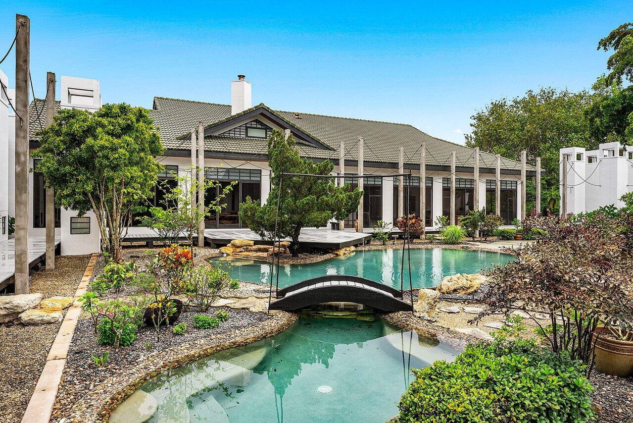 8549 Surrey Lane Boca Raton, FL 33496 - Photo 55 of 106 a front view of a house with garden