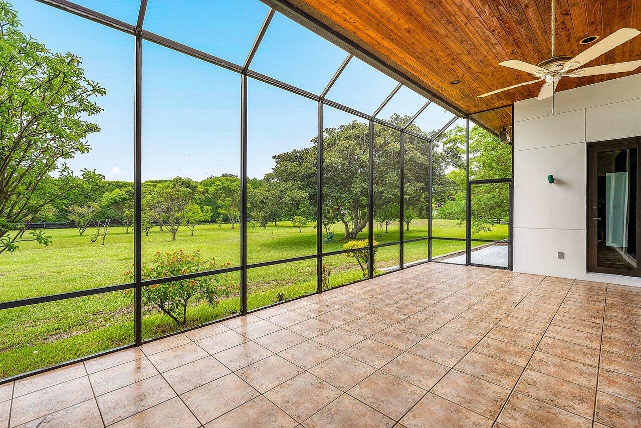 8549 Surrey Lane Boca Raton, FL 33496 - Photo 59 of 106 a view of a deck with a big yard