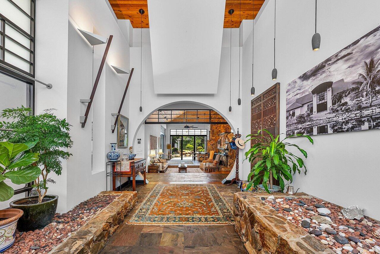 8549 Surrey Lane Boca Raton, FL 33496 - Photo 6 of 106 a view of an entryway with a potted plant