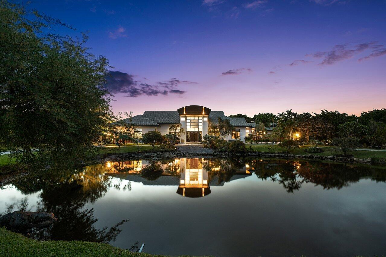 8549 Surrey Lane Boca Raton, FL 33496 - Photo 81 of 106 a lake view with boat and palm trees