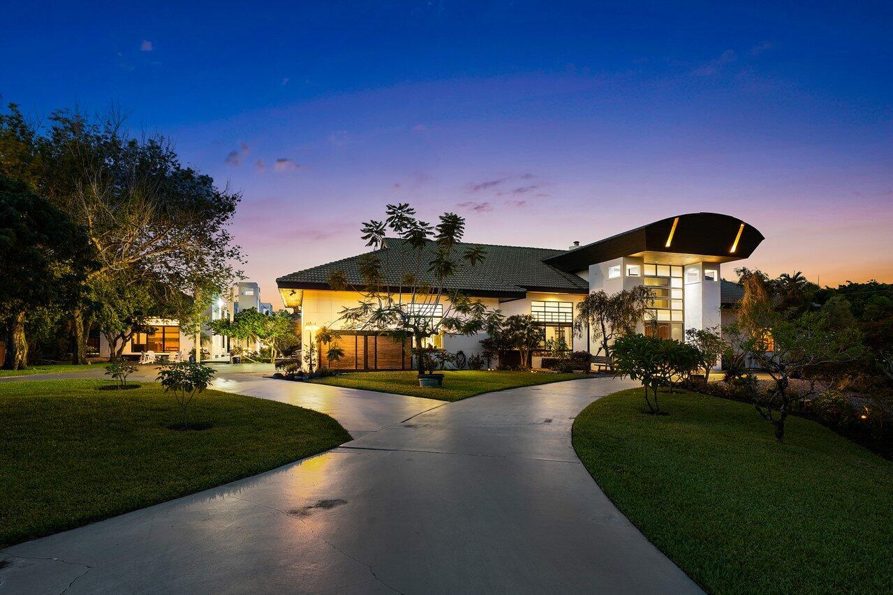 8549 Surrey Lane Boca Raton, FL 33496 - Photo 83 of 106 a view of a big yard with a house in the background