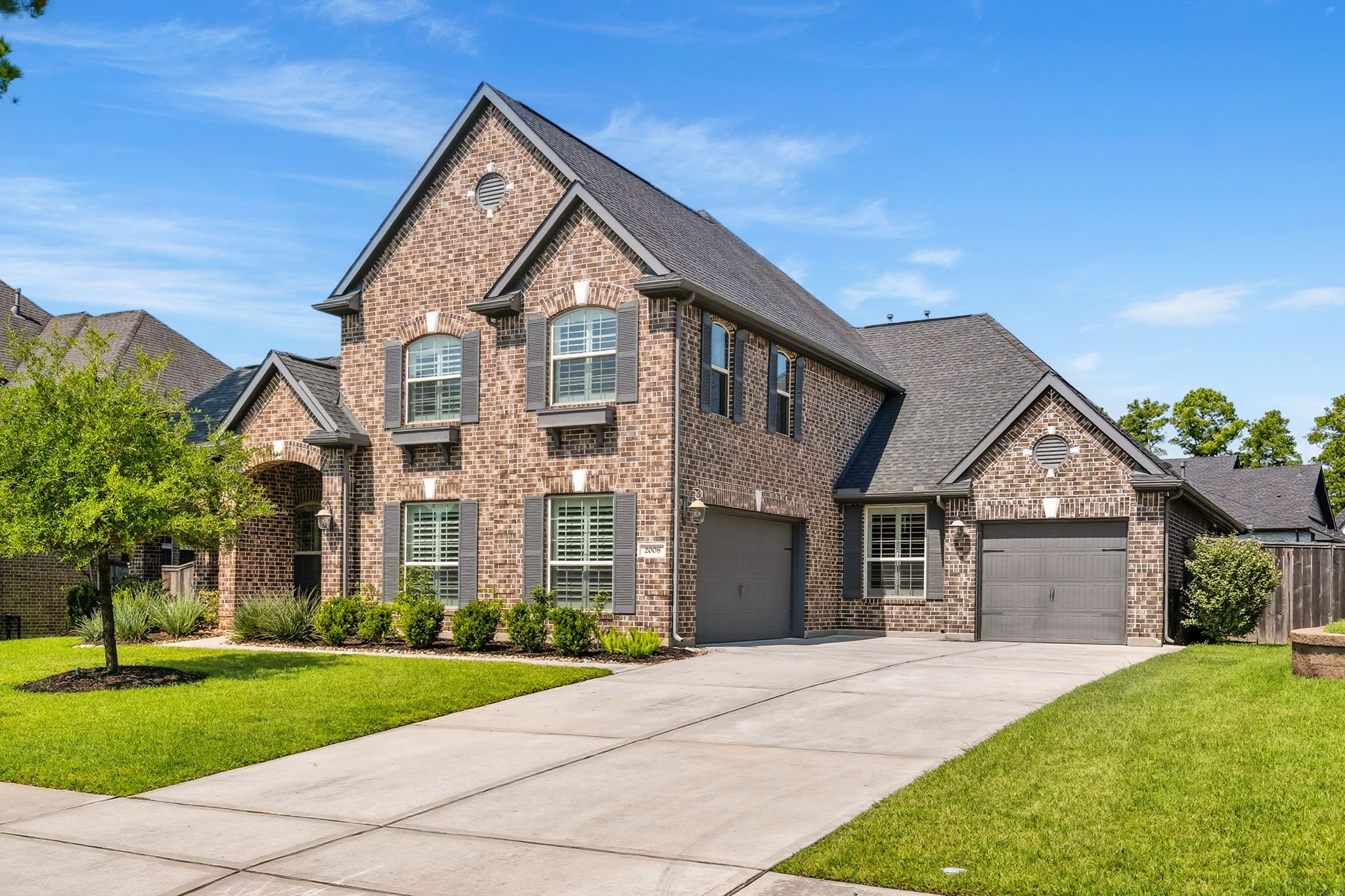 2008 Green Terrace Lane Pinehurst, TX 77362 - Photo 1 of 47 Welcome home in 2026 to 2008 Green Terrace Lane. This is a beautiful 1.5-story brick home with a spacious driveway and a three-car garage. It features well-maintained landscaping, a lush green lawn, and charming plantation shutters on the front facing windows. Home is on a quiet cul-de-sac street.