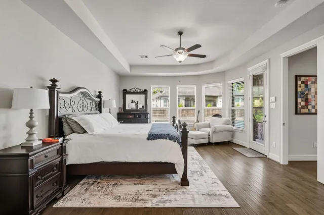 a bedroom with furniture and a fireplace