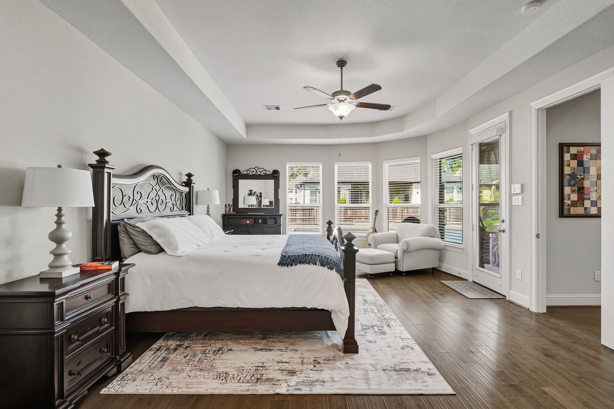 2008 Green Terrace Lane Pinehurst, TX 77362 - Photo 19 of 47 Experience serenity in the spacious primary suite, flooded with natural light, high ceilings and ample space for a cozy sitting area.