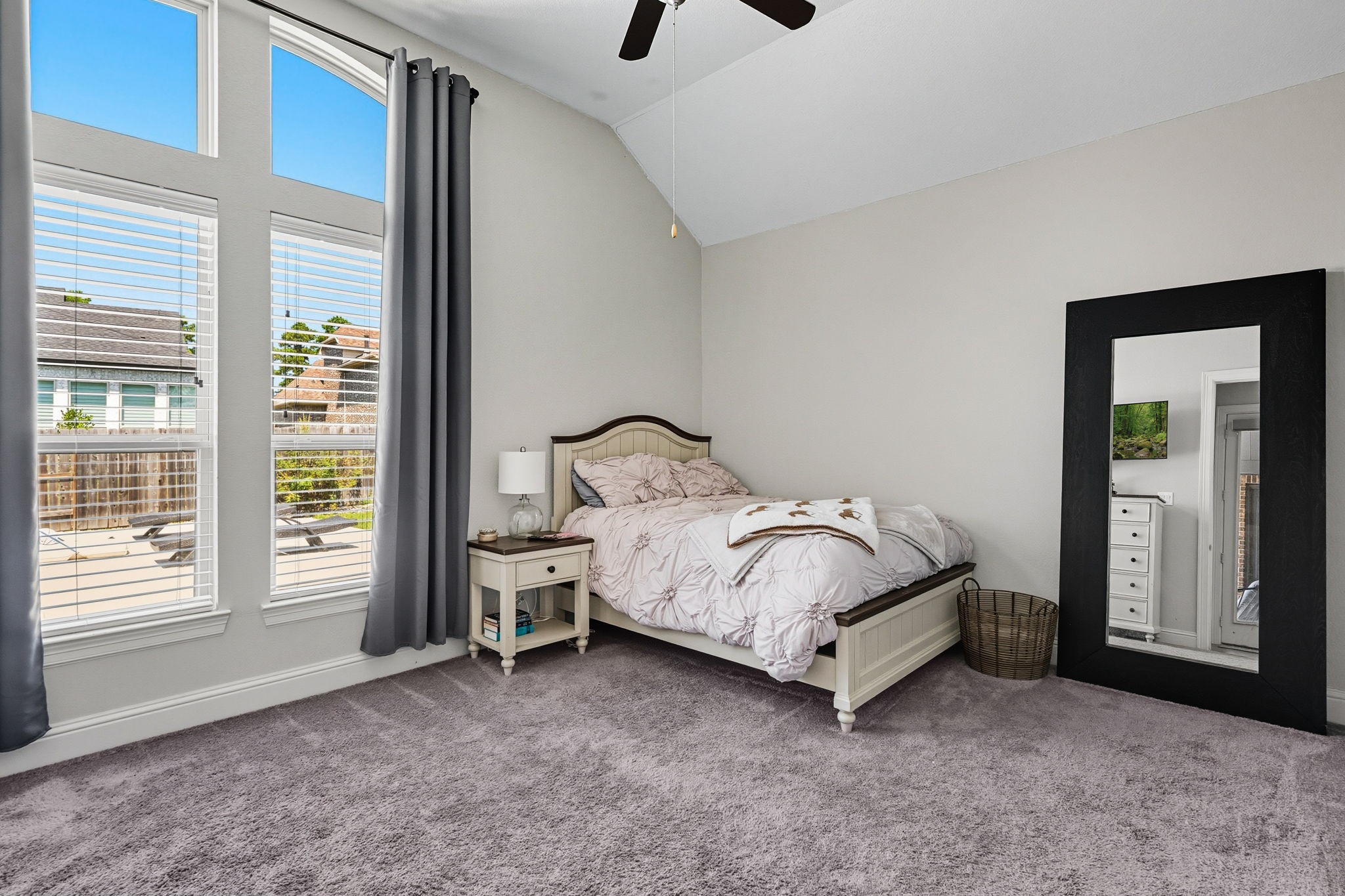 2008 Green Terrace Lane Pinehurst, TX 77362 - Photo 28 of 47 Bedroom #2 is spacious and has a lot of natural light from the windows. Large walk-in closet, high ceilings and ceiling fan.