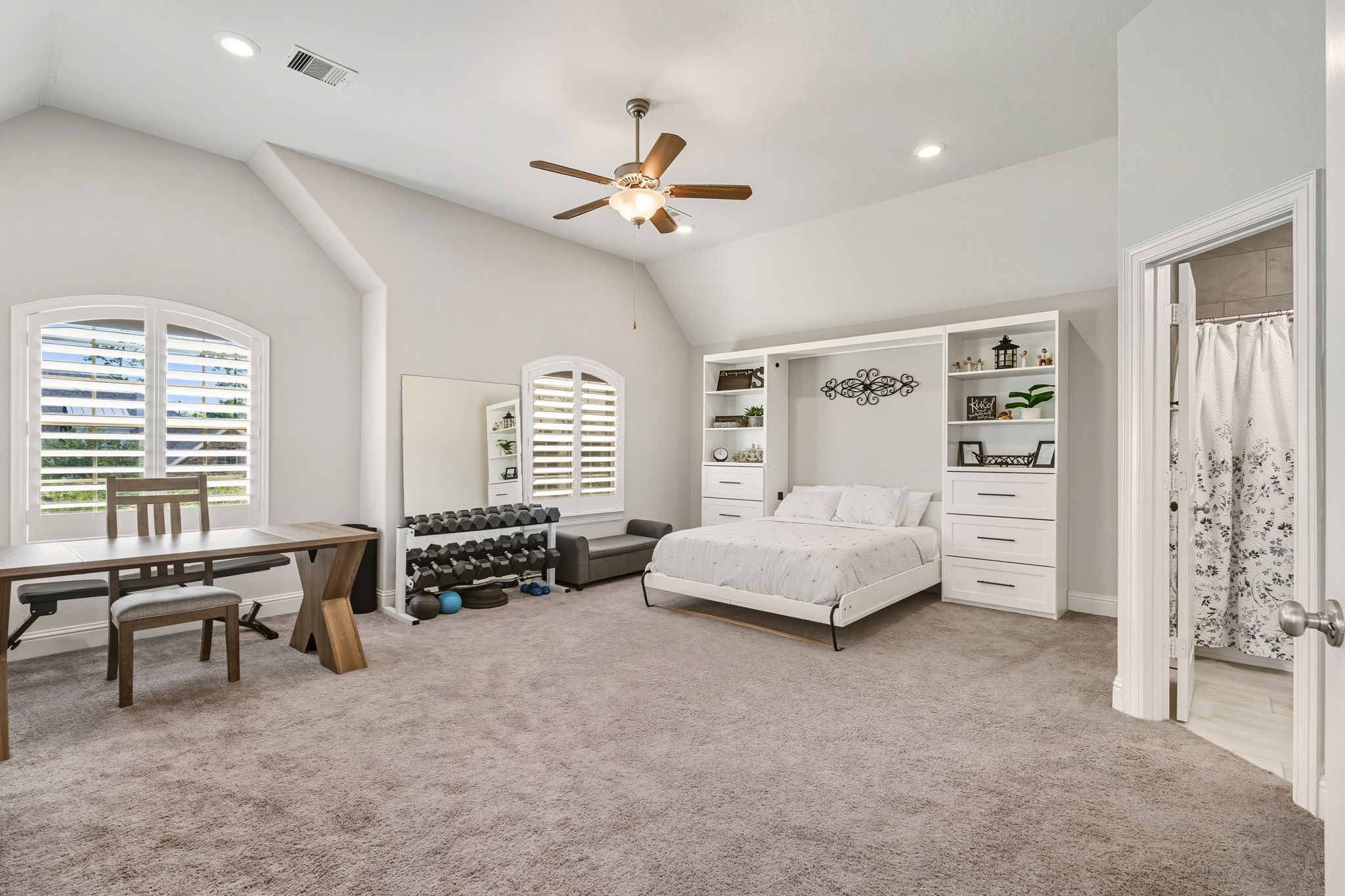 2008 Green Terrace Lane Pinehurst, TX 77362 - Photo 29 of 47 Bedroom #3 is on second floor and can be used as a guest suite, bedroom or game room. The bed folds up into a murphy bed to allow more space. Guest bathroom and closet in the room allows for a serene location for guests to stay.