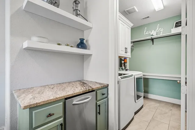 a view of a house with swimming pool and sitting area