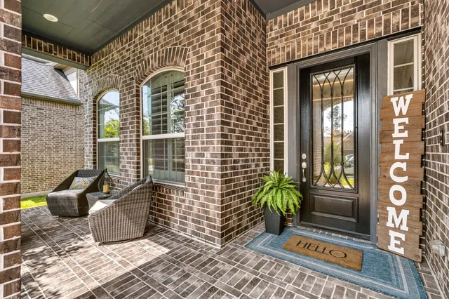 a view of a door and chair in the patio