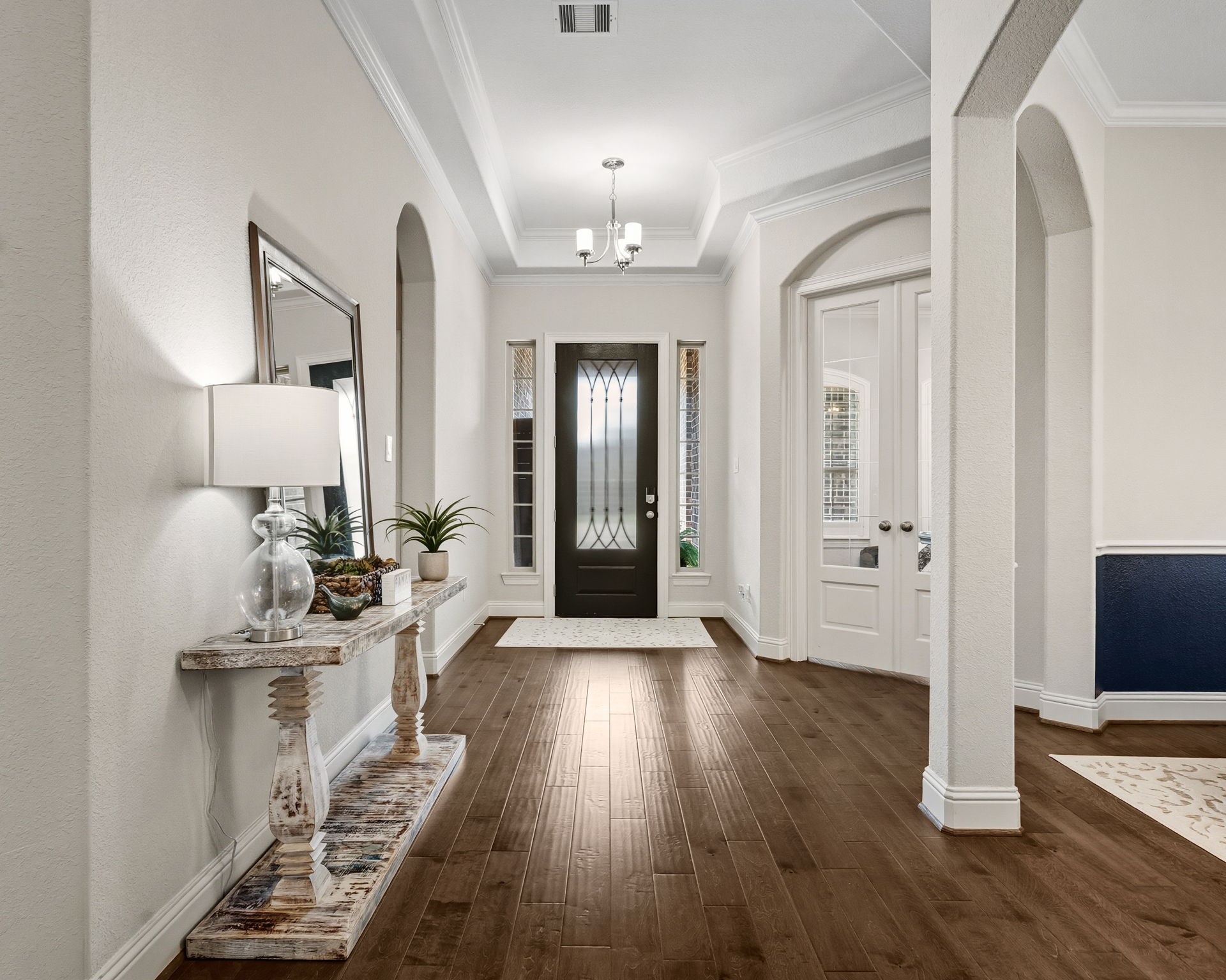 2008 Green Terrace Lane Pinehurst, TX 77362 - Photo 5 of 47 This elegant entryway features hardwood flooring, high ceilings, and a beautiful front door with sidelights. The space is bright and inviting, with neutral walls and quick access to the home office/study and the everyday living areas.