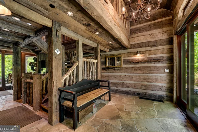 a bedroom with a bed next to a window