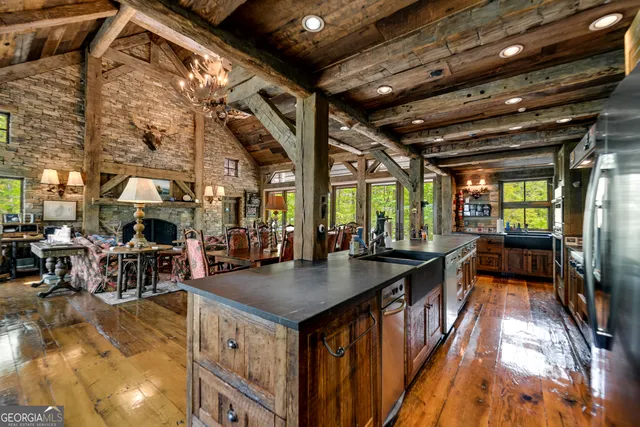 a view of an entryway with wooden floor and a livingroom view