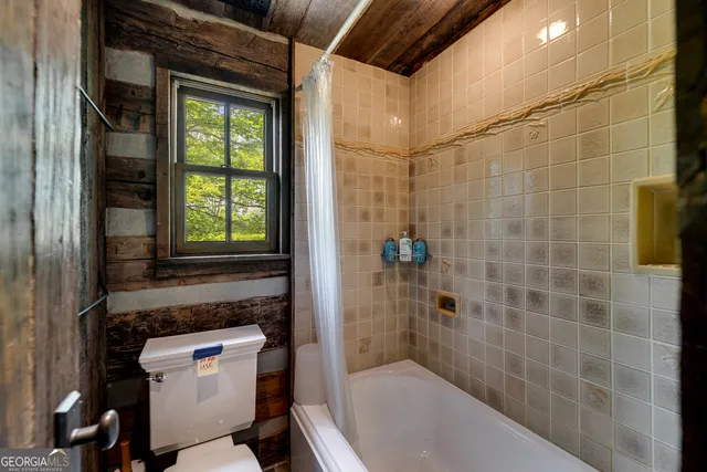 a view of deck with table and chairs and wooden floor