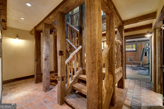 an aerial view of a house with a yard and lake view