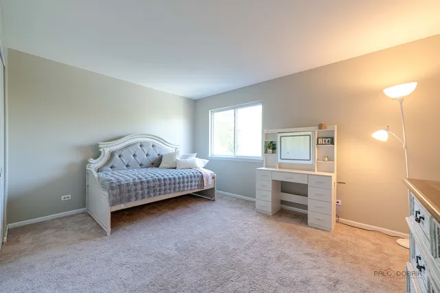 a bedroom with a bed and a cabinets